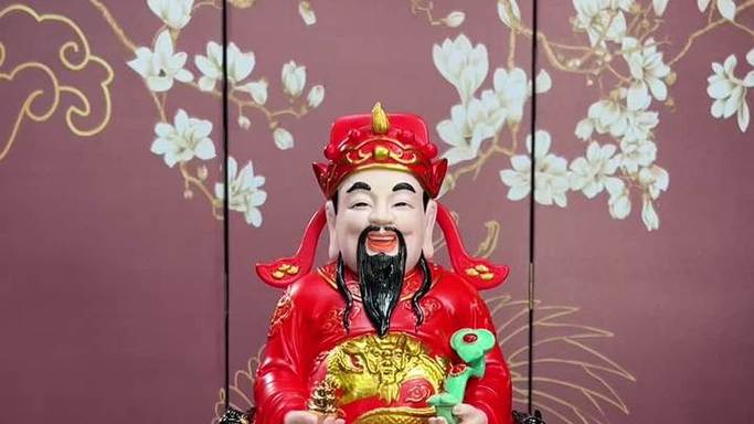 一手拿如意一手拿元宝是什么财神